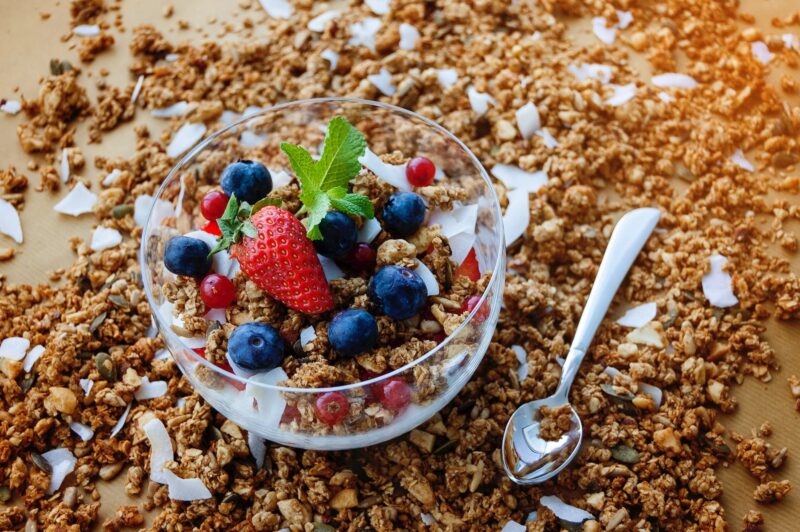 strawberry and blueberry on clear glass bowl